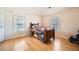 Bright bedroom with wood floors and two windows providing natural light at 1342 Orchard Park Dr, Stone Mountain, GA 30083