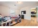 Cozy bedroom with wood floors, a TV, and easy access to other rooms at 1342 Orchard Park Dr, Stone Mountain, GA 30083