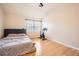 Bright bedroom with hardwood floors, a ceiling fan, and plenty of natural light at 1342 Orchard Park Dr, Stone Mountain, GA 30083
