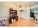 Bright dining area featuring chandelier lighting and view into the kitchen at 1342 Orchard Park Dr, Stone Mountain, GA 30083
