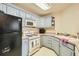 Efficient kitchen featuring light blue cabinets, modern appliances, and ample counter space at 1342 Orchard Park Dr, Stone Mountain, GA 30083