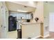Functional kitchen area featuring updated appliances and easy access to the entryway at 1342 Orchard Park Dr, Stone Mountain, GA 30083