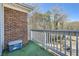 Outdoor patio space with brick wall and white railing, great for relaxing at 1342 Orchard Park Dr, Stone Mountain, GA 30083