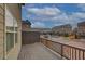 Rear view of a townhome community featuring private decks and a paved street at 2203 Fullers Aly, Kennesaw, GA 30144