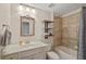 Well-lit bathroom with a shower-tub combination, floating shelves, and decorative mirror at 2203 Fullers Aly, Kennesaw, GA 30144