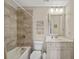 Well-lit bathroom showcases stylish tile work, a tub-shower combo, and vanity with plenty of storage at 2203 Fullers Aly, Kennesaw, GA 30144