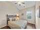 Bedroom with a vaulted ceiling, hardwood floors, and bright window at 2203 Fullers Aly, Kennesaw, GA 30144