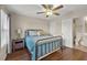 Cozy bedroom boasts hardwood floors, a ceiling fan, and an ensuite bathroom for added convenience at 2203 Fullers Aly, Kennesaw, GA 30144