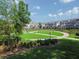Picturesque community with townhomes surrounding a common green space and walking paths at 2203 Fullers Aly, Kennesaw, GA 30144