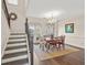 Bright dining room with hardwood floors, chandelier, and French doors opening to an outdoor space at 2203 Fullers Aly, Kennesaw, GA 30144
