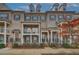 Beautiful brick townhome exteriors with covered entrances, balconies, and professional landscaping at 2203 Fullers Aly, Kennesaw, GA 30144