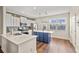 Modern kitchen featuring white cabinets, stainless steel appliances, and a center island for efficient and stylish cooking at 2203 Fullers Aly, Kennesaw, GA 30144