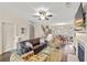 Cozy living room with hardwood floors, fireplace, access to dining area and stairs to upper level at 2203 Fullers Aly, Kennesaw, GA 30144