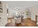 Open-concept living room with a cozy fireplace, built-in shelving, and hardwood floors creates a welcoming atmosphere at 2203 Fullers Aly, Kennesaw, GA 30144
