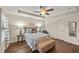 Bedroom features a tray ceiling, hardwood floors, and bright windows at 2203 Fullers Aly, Kennesaw, GA 30144