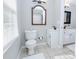 Well-lit bathroom with a white toilet, tile flooring, and dual sinks at 2904 Pleasant Ridge Dr, Decatur, GA 30034
