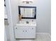 Classic bathroom features a white vanity with black hardware and a framed rectangular mirror at 2904 Pleasant Ridge Dr, Decatur, GA 30034