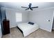 Comfortable bedroom features a ceiling fan, television, and cozy carpeting at 2904 Pleasant Ridge Dr, Decatur, GA 30034