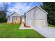Charming single-Gathering home featuring a brick facade, well-manicured lawn, and attached two-car garage at 2904 Pleasant Ridge Dr, Decatur, GA 30034