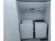 Functional laundry room with a washer, dryer, and shelving for storage at 2904 Pleasant Ridge Dr, Decatur, GA 30034