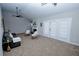 Bright living room with vaulted ceilings, ceiling fan, and access to a patio with double doors at 2904 Pleasant Ridge Dr, Decatur, GA 30034
