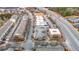 Aerial view of a neighborhood with a main street, restaurants and shops at 3831 Portland Trail Dr, Suwanee, GA 30024