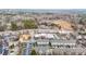 Aerial view showcasing commercial businesses, residential living and landscape at 3831 Portland Trail Dr, Suwanee, GA 30024