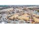 Aerial view of well landscaped park with shops and businesses surrounding it at 3831 Portland Trail Dr, Suwanee, GA 30024