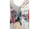 Walk-in closet with custom shelving and drawers for optimal storage and organization at 3831 Portland Trail Dr, Suwanee, GA 30024
