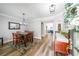 Bright dining room features modern lighting, seating for six, and wood floors, perfect for entertaining at 3831 Portland Trail Dr, Suwanee, GA 30024