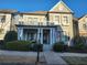 Charming two-story home with a welcoming front porch and manicured landscaping at 3831 Portland Trail Dr, Suwanee, GA 30024
