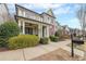 Inviting two-story home features a cozy front porch, upper balcony, and a well-manicured front yard at 3831 Portland Trail Dr, Suwanee, GA 30024