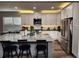 Modern kitchen with stainless steel appliances, granite countertops, and a spacious island at 3831 Portland Trail Dr, Suwanee, GA 30024