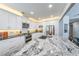 Modern kitchen with stainless steel appliances, granite countertops and a large island with breakfast bar at 3831 Portland Trail Dr, Suwanee, GA 30024