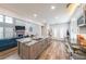 Open concept kitchen with granite island, stainless appliances, open to the spacious living room at 3831 Portland Trail Dr, Suwanee, GA 30024