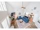 Open-concept living room with vaulted ceilings, fireplace, and a view into the kitchen at 3831 Portland Trail Dr, Suwanee, GA 30024