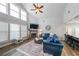 Spacious living room with vaulted ceilings, fireplace, and large windows offering abundant natural light at 3831 Portland Trail Dr, Suwanee, GA 30024