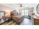 Serene main bedroom with tray ceilings, wood floors, lots of natural light, and a cozy ambiance at 3831 Portland Trail Dr, Suwanee, GA 30024