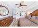 Well-lit main bedroom with wood floors, crown molding, access to the walk in closet and main bath at 3831 Portland Trail Dr, Suwanee, GA 30024