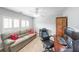 Bright office with a sofa, desk, computer, and a rolling leather chair at 3831 Portland Trail Dr, Suwanee, GA 30024