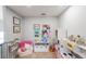 Playroom featuring a toy kitchen, shelving, and a cozy reading nook at 3831 Portland Trail Dr, Suwanee, GA 30024