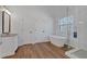 Bright bathroom featuring soaking tub and glass shower at 473 Silverleaf Ln, Dallas, GA 30157