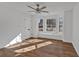 Clean bedroom with ample natural light, new hardwood flooring, and a ceiling fan at 473 Silverleaf Ln, Dallas, GA 30157