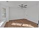 Clean bedroom with ample natural light, new hardwood flooring, and a ceiling fan at 473 Silverleaf Ln, Dallas, GA 30157