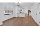 Dining room with hardwood floors, window, and an open view of the kitchen at 473 Silverleaf Ln, Dallas, GA 30157