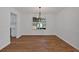 Dining room with wood floors and white walls with large window for natural lighting at 473 Silverleaf Ln, Dallas, GA 30157