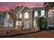 Charming two-story home featuring a stone facade, attached garage, and well-maintained landscaping at 473 Silverleaf Ln, Dallas, GA 30157