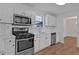 Stylish kitchen featuring stainless steel appliances, white subway tile, and granite countertops at 473 Silverleaf Ln, Dallas, GA 30157