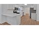 Well-appointed kitchen with white cabinets, stainless steel appliances, and durable countertops at 473 Silverleaf Ln, Dallas, GA 30157