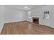 Bright living room boasting hardwood floors, a fireplace and lots of natural light at 473 Silverleaf Ln, Dallas, GA 30157